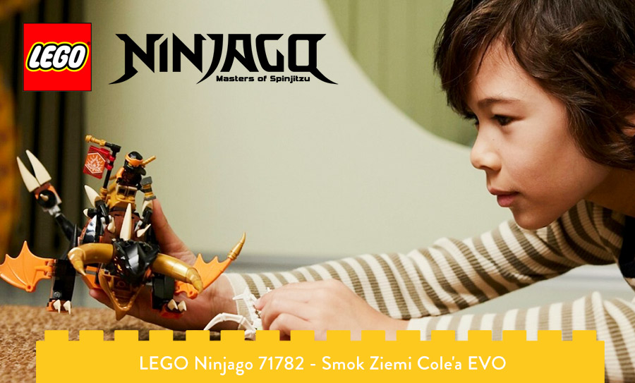 Chłopiec bawi się smokiem cola z LEGO